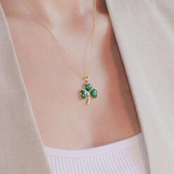 irish gold vermeil shamrock necklace with malachite green stones on model